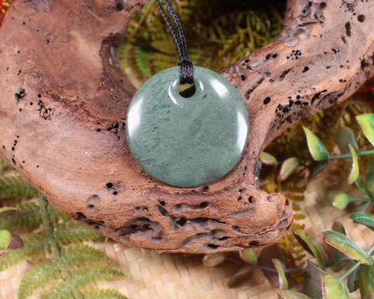 Porowhita or Pi Stone carved from NZ Pakohe or Argillite