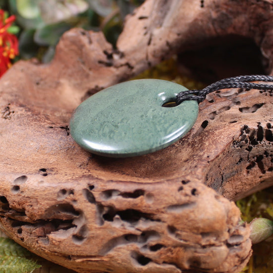 Porowhita or Pi Stone carved from NZ Pakohe or Argillite