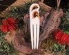 Heru with Koru carved from beef bone