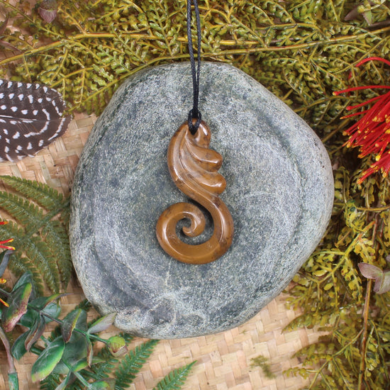 Koru or Spiral carved from NZ Fossilised Wood