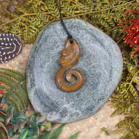 Koru or Spiral carved from NZ Fossilised Wood