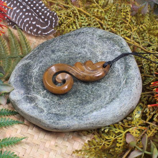 Koru or Spiral carved from NZ Fossilised Wood