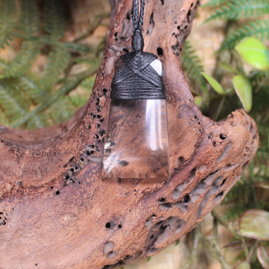 Toki pendant carved from Smokey Quartz