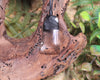 Toki pendant carved from Smokey Quartz