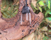 Toki pendant carved from Smokey Quartz