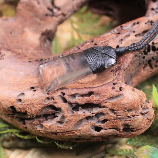 Toki pendant carved from Smokey Quartz