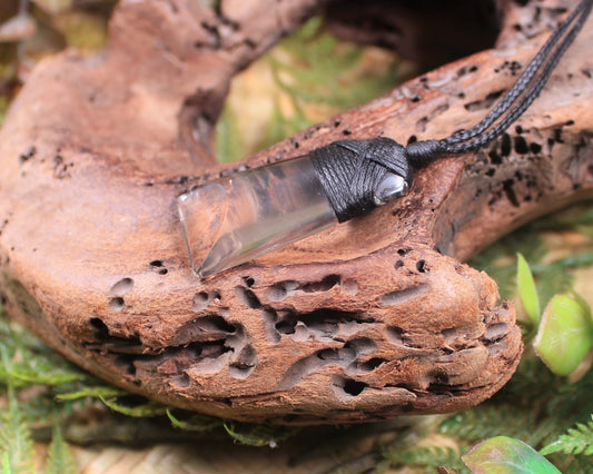 Toki pendant carved from Smokey Quartz