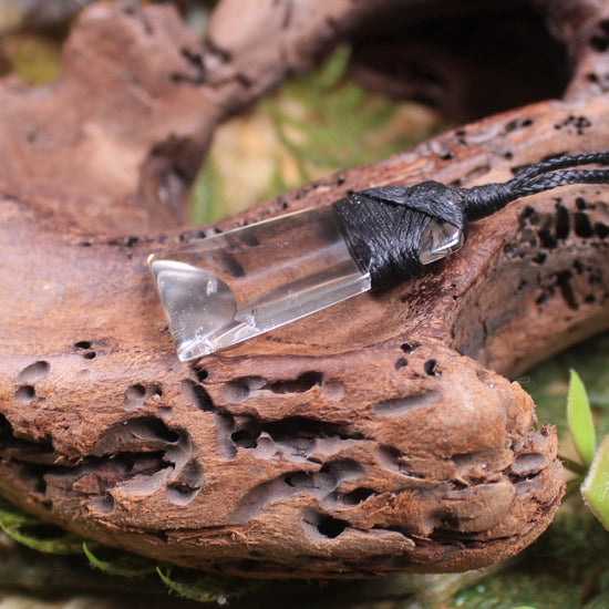 Toki pendant carved from Smokey Quartz