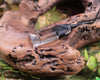 Toki pendant carved from Smokey Quartz
