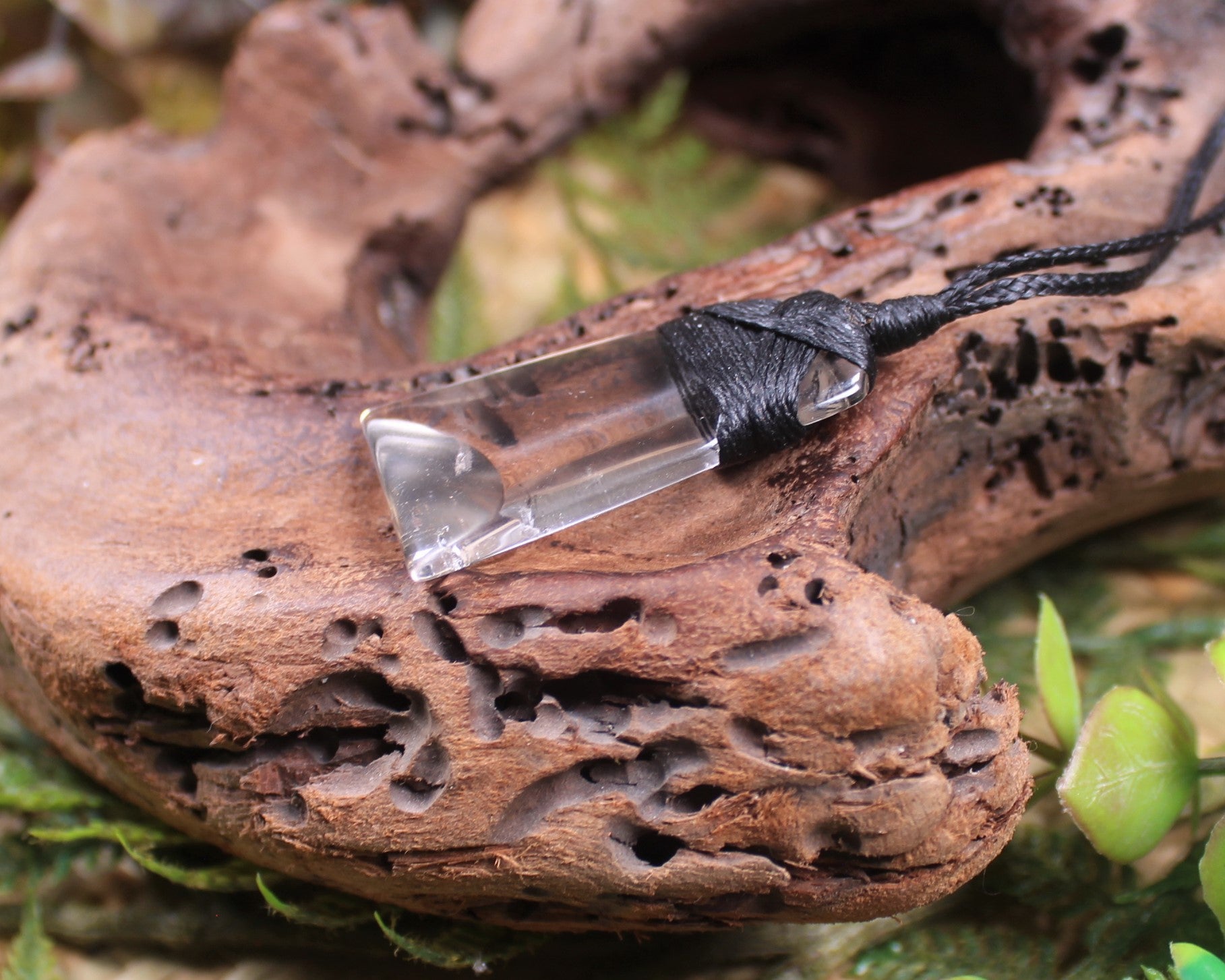 Toki pendant carved from Smokey Quartz