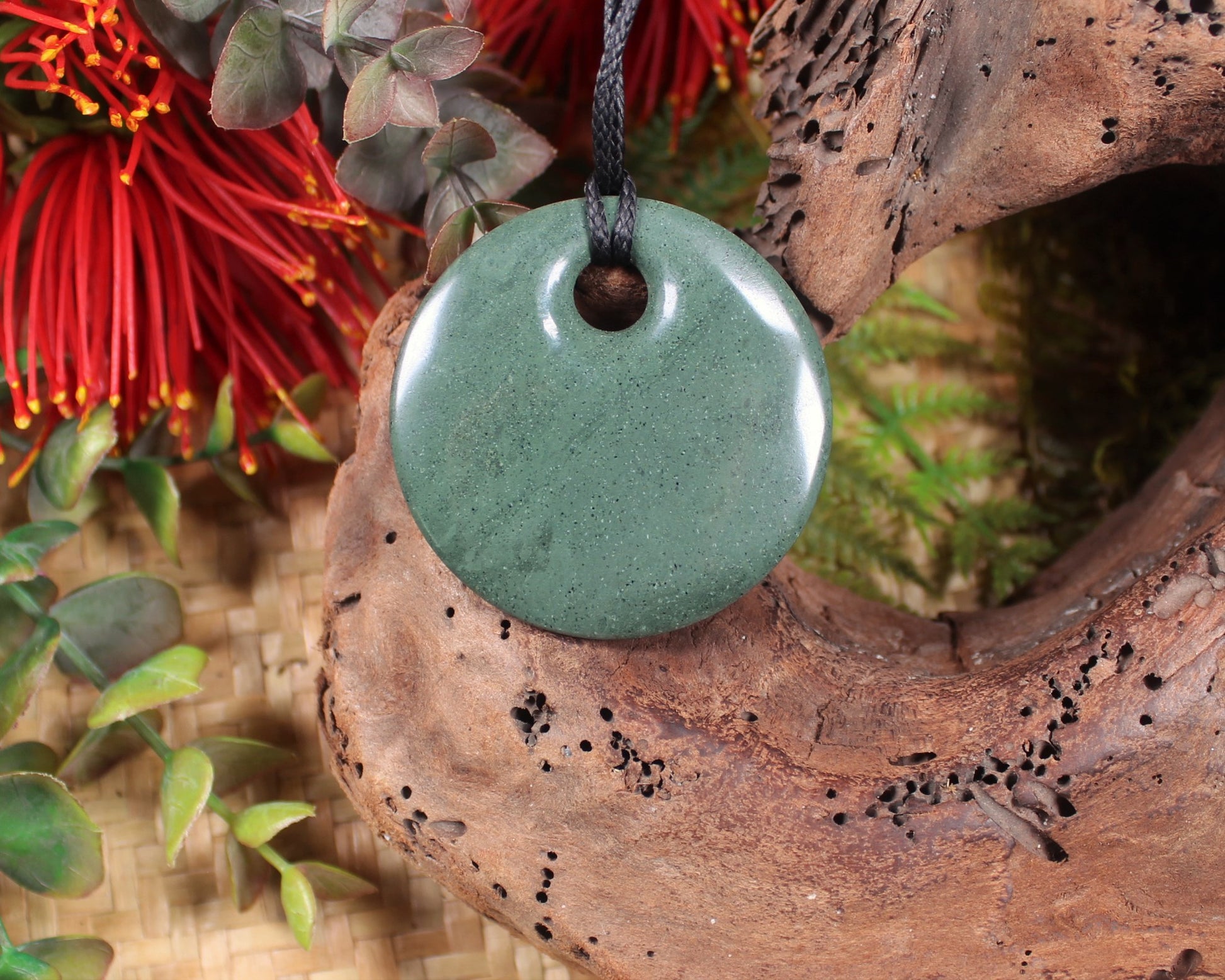 Porowhita or Pi Stone carved from NZ Pakohe or Argillite