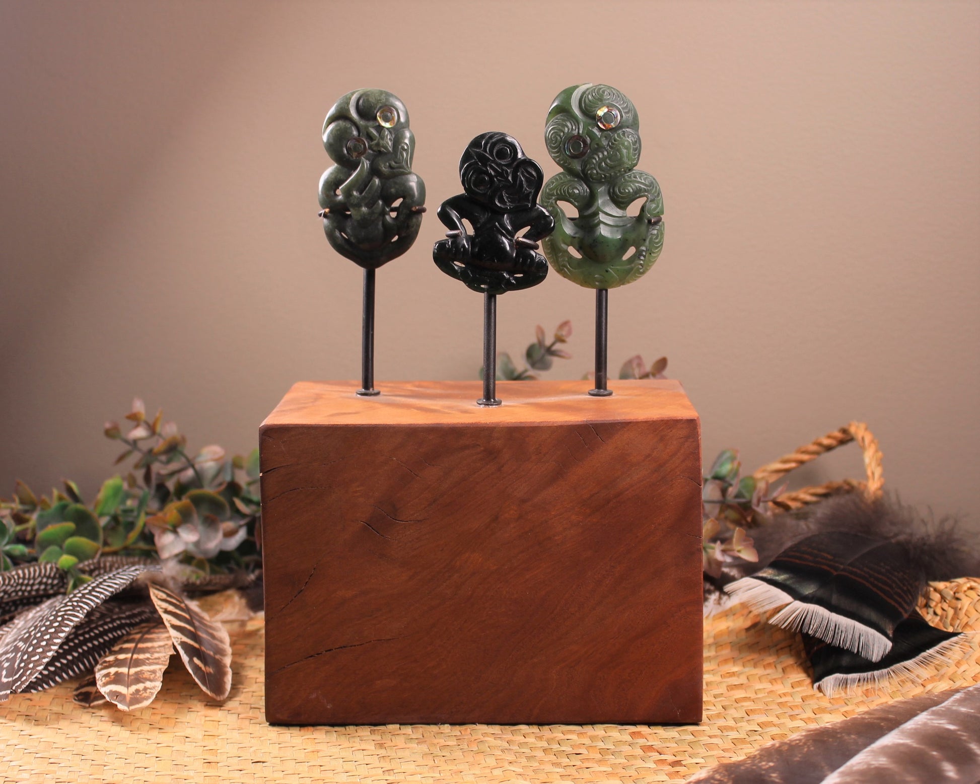 Hei Tiki Sculpture from Hapopo and Kawakawa Pounamu set into a Wooden base - NZ Greenstone