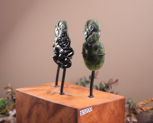 Hei Tiki Sculpture from Hapopo and Kawakawa Pounamu set into a Wooden base - NZ Greenstone