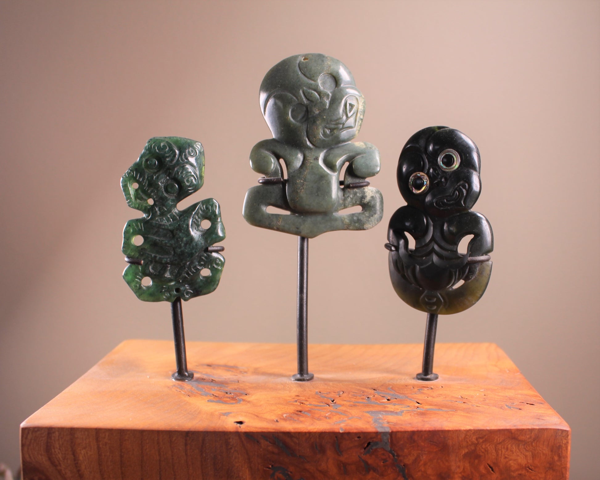 Hei Tiki Sculpture from Hapopo and Kawakawa Pounamu set into a Wooden base - NZ Greenstone