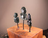 Hei Tiki Sculpture from Hapopo and Kawakawa Pounamu set into a Wooden base - NZ Greenstone